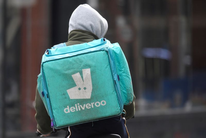&copy; Reuters. A Deliveroo delivery rider cycles in London