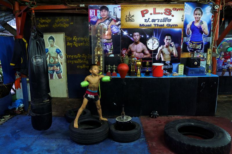 &copy; Reuters. The Wider Image: Punching out of poverty: Despite risks, nine-year-old Thai fighter eager to return to ring