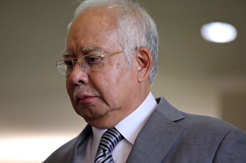 &copy; Reuters. FILE PHOTO: Former Malaysian Prime Minister Najib Razak reacts during a break at Kuala Lumpur High Court in Kuala Lumpur