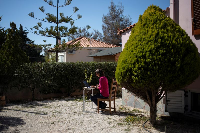 &copy; Reuters. Rowena Harding works at the garden of her house, on the island of Aegina