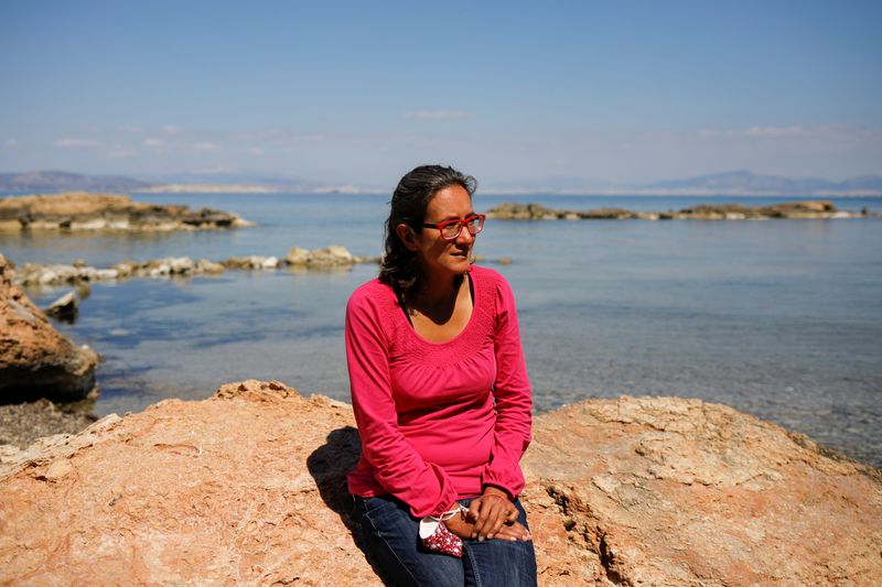 © Reuters. Rowena Harding sits on the seaside during an interview with Reuters, on the island of Aegina