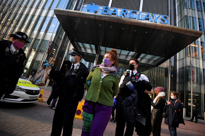 © Reuters. Extinction Rebellion activists protest outside Barclays building in London