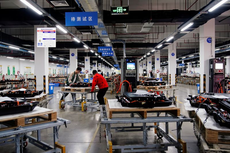 &copy; Reuters. Employees work on the production line of electric vehicle (EV) battery manufacturer Octillion in Hefei
