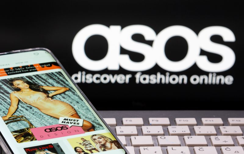 &copy; Reuters. Smartphone with an ASOS app and a keyboard are seen in front of a displayed ASOS logo in this illustration picture