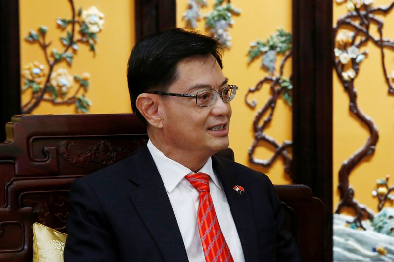 &copy; Reuters. FILE PHOTO: Singapore&apos;s Deputy Prime Minister Heng Swee Keat attends a meeting at Diaoyutai state guesthouse in Beijing