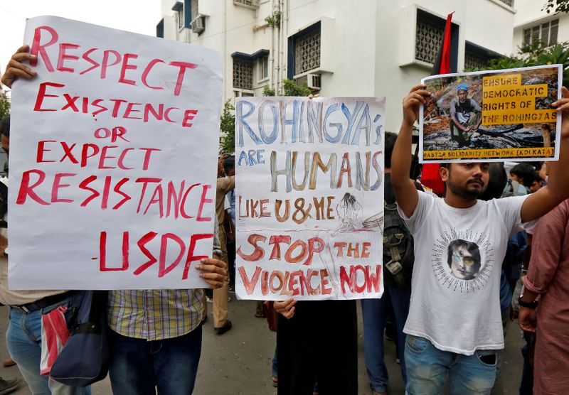 &copy; Reuters. FILE PHOTO: People hold placards during a protest rally against what the protesters say are killings of Rohingya people in Myanmar, in front of Myanmar consulate in Kolkata