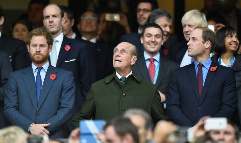 © Reuters. FILE PHOTO: Britain's Prince Harry, Prince Philip and Prince William attend the Rugby World Cup final match between New Zealand against Australia at Twickenham in London