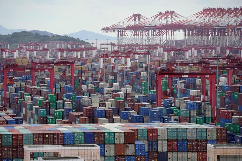 © Reuters. FILE PHOTO: Containers are seen at the Yangshan Deep-Water Port in Shanghai