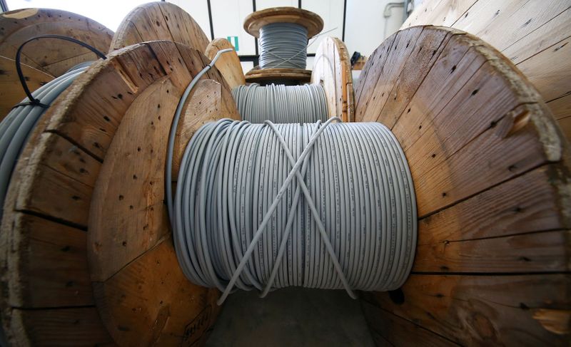 © Reuters. FILE PHOTO: Spools of fibre optic cables