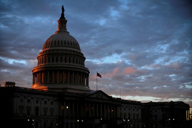 &copy; Reuters. FILE PHOTO: The sun sets behind the U.S. Capitol dome in Washington