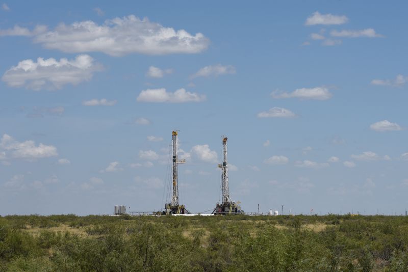 &copy; Reuters. Horizontal drilling rigs operate in the Permian Basin oil production area near Wink