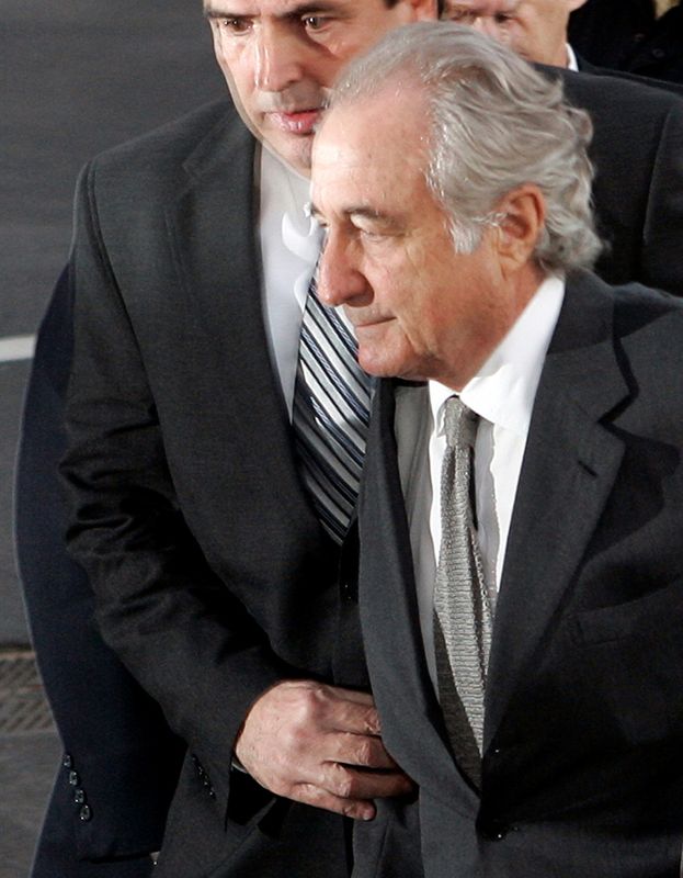 © Reuters. FILE PHOTO: Accused swindler Bernard Madoff enters the Manhattan federal court house in New York