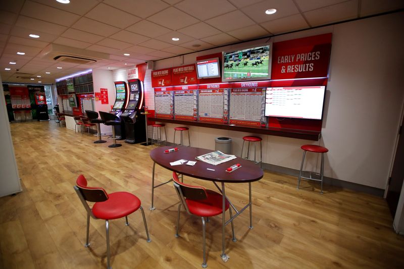 &copy; Reuters. FILE PHOTO: General view inside a deserted Ladbrokes shop in Harpenden