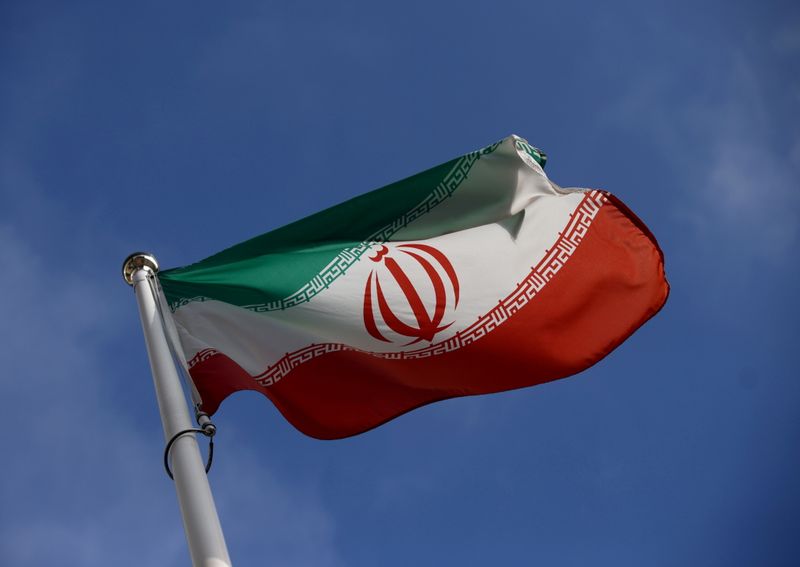 &copy; Reuters. FILE PHOTO: The Iranian flag waves in front of the International Atomic Energy Agency (IAEA) headquarters, before the beginning of a board of governors meeting, amid the coronavirus disease