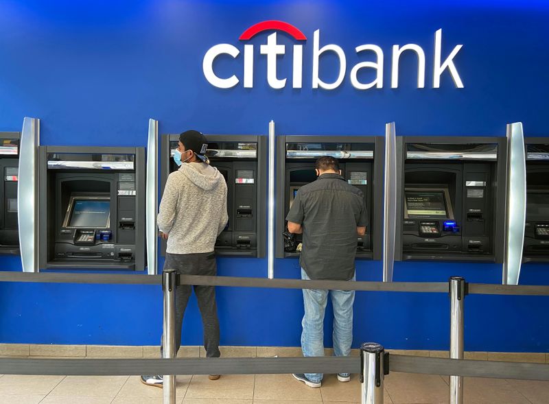 &copy; Reuters. Customers use ATMs at Citibank branch in New York City
