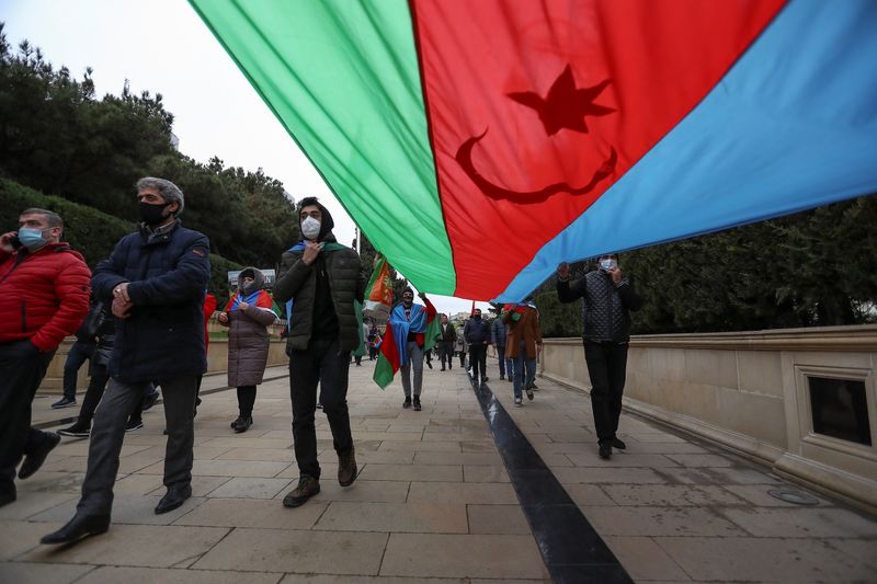 &copy; Reuters. People take part in street celebrations after Lachin District came under the control of Azerbaijan&apos;s troops in Baku