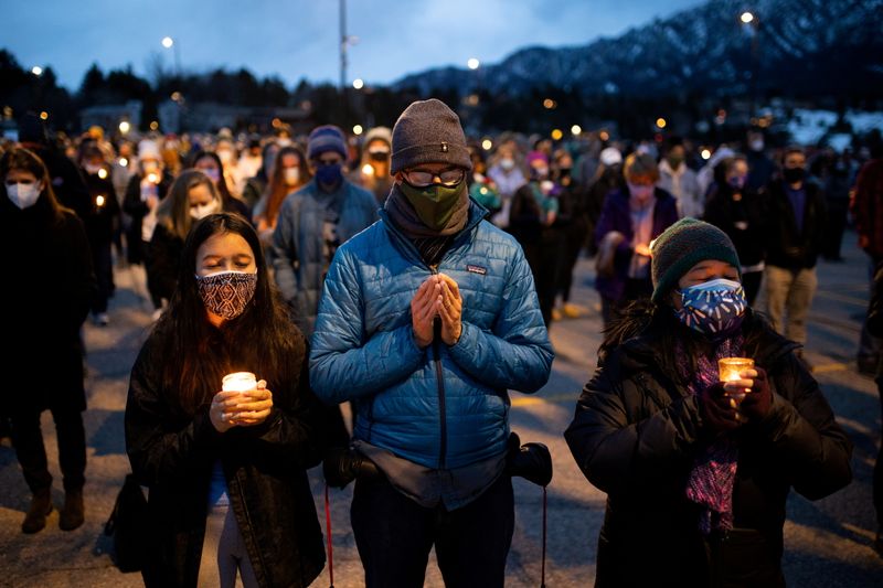 &copy; Reuters. FILE PHOTO: Hundreds gather for candlelight vigil after mass shooting in Boulder Colorado at King Soopers