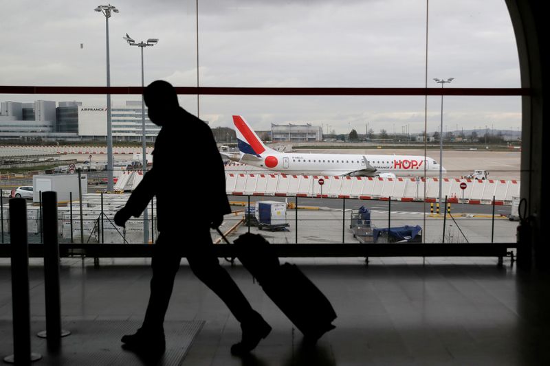 &copy; Reuters. FILE PHOTO: Police measures and sanitary checks at Roissy airport after French borders closed to non-essential travel