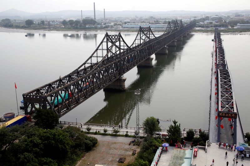 &copy; Reuters. FILE PHOTO: Trucks cross Friendship Bridge from China&apos;s Dandong, Liaoning province, to North Korea&apos;s Sinuiju
