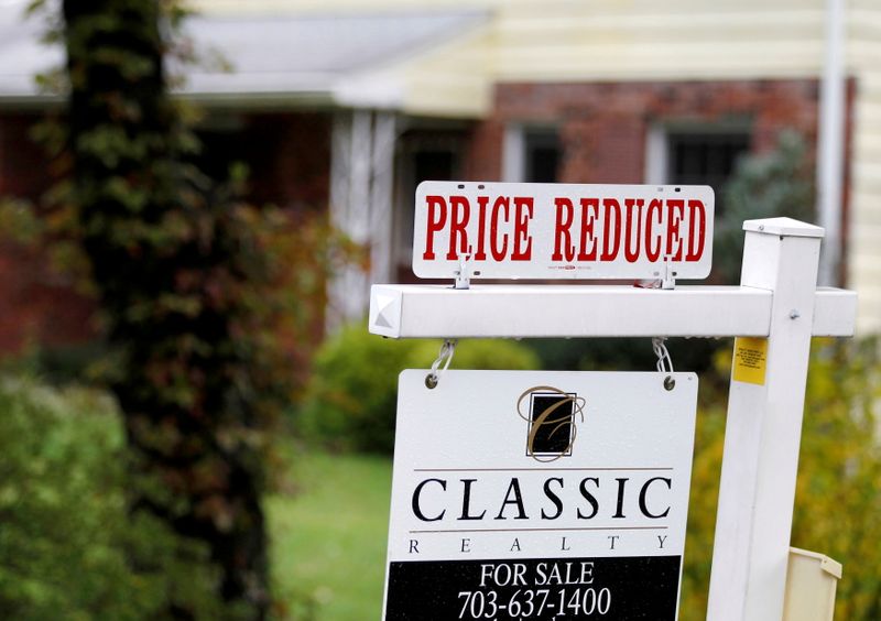 &copy; Reuters. FILE PHOTO: A &quot;Price Reduced&quot; sign is displayed on a home for sale in northern Virginia suburb of Vienna
