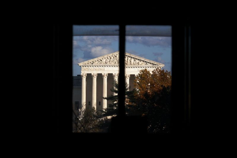 &copy; Reuters. FILE PHOTO: The U.S. Supreme Court building is seen behind a window in Washington