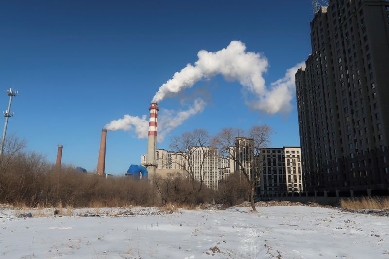 &copy; Reuters. FILE PHOTO: A coal-fired heating complex is seen behind the ground covered by snow in Harbin