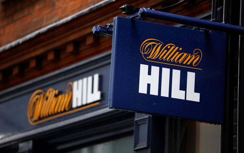 &copy; Reuters. Signs are seen outside a branch of bookmaker William Hill in central London
