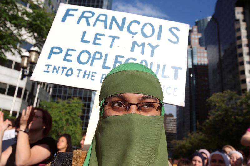 &copy; Reuters. FILE PHOTO: People protest Quebec&apos;s new Bill 21 in Montreal