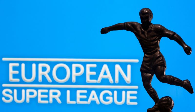 &copy; Reuters. A metal figure of a football player with a ball is seen in front of the words &quot;European Super League&quot; in this illustration