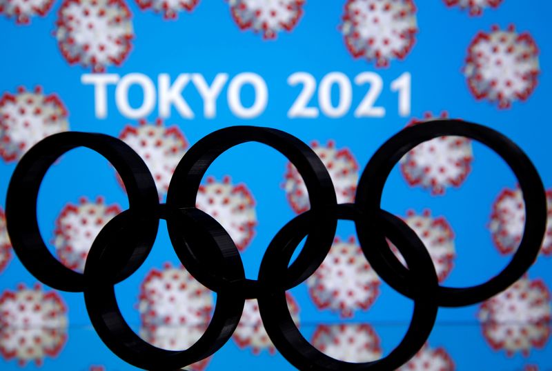 &copy; Reuters. A 3D printed Olympics logo is seen in front of displayed  &quot;Tokyo 2021&quot; words in this illustration