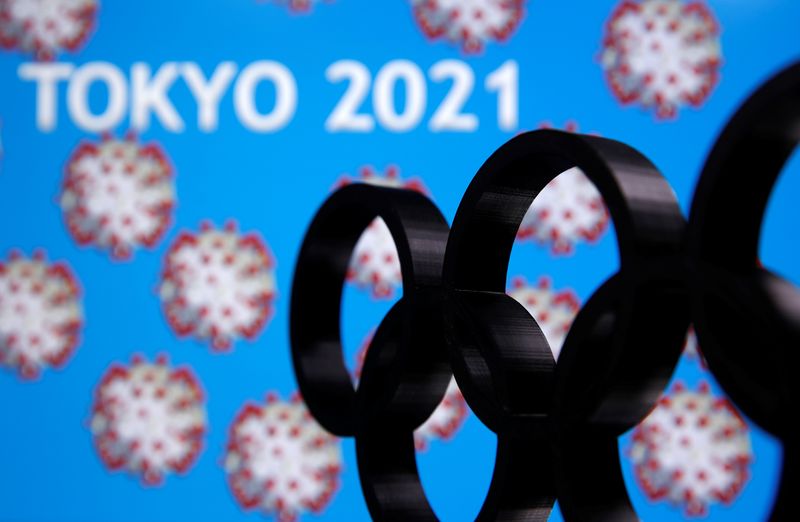 © Reuters. A 3D printed Olympics logo is seen in front of displayed  