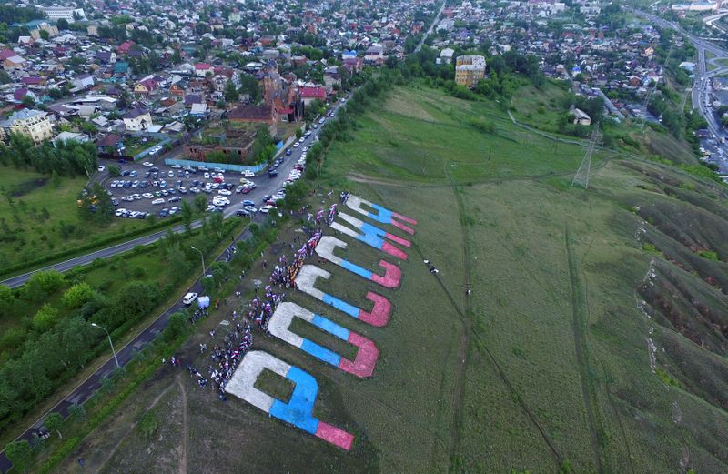 &copy; Reuters. An aerial view shows people gathering next to a giant sign reading &quot;Russia&quot; on the Day of Russia in Krasnoyarsk