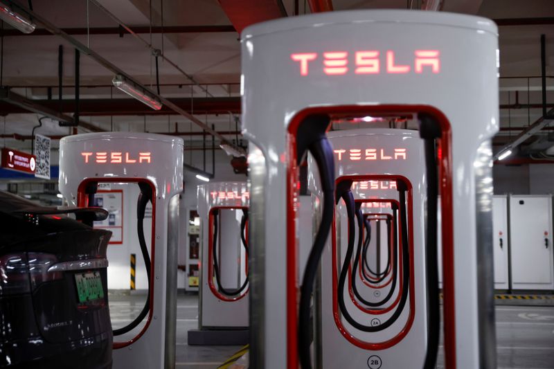 &copy; Reuters. Tesla charging stations are pictured in a parking lot in Shanghai