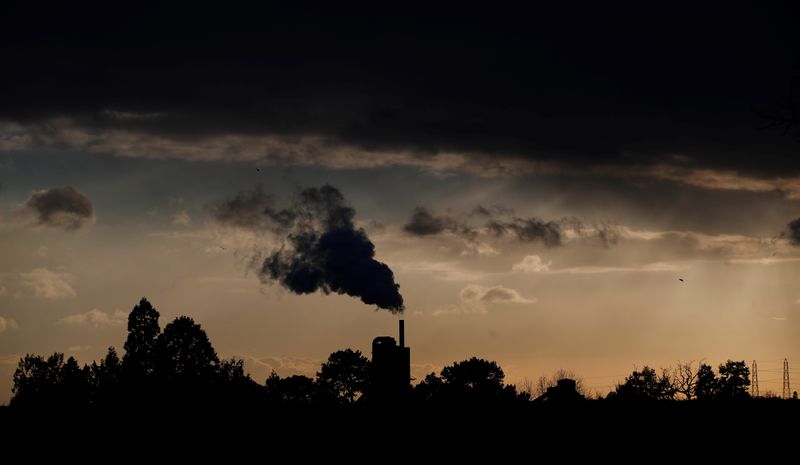 &copy; Reuters. Smoke rises above a factory at sunset in Rugby