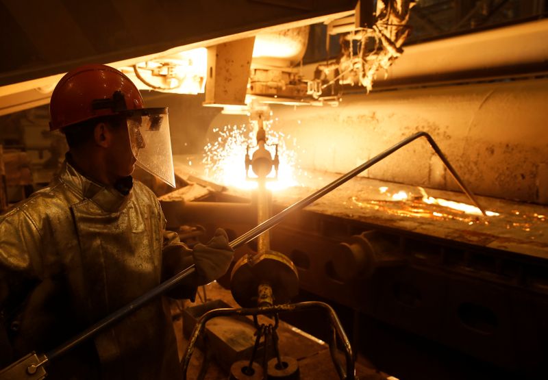 &copy; Reuters. Employee checks temperature of iron at continuous casting machine at NLMK Kaluga steel mill in Vorsino outside Kaluga