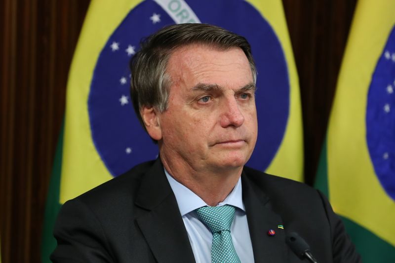 &copy; Reuters. FILE PHOTO: Brazil&apos;s President Bolsonaro attends a virtual global climate summit via a video link in Brasilia