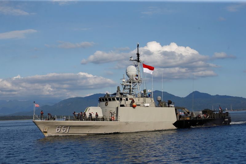 &copy; Reuters. Indonesian Navy&apos;s KRI Singa-651 leaves the Tanjung Wangi port as the search continues for the missing KRI Nanggala-402 submarine