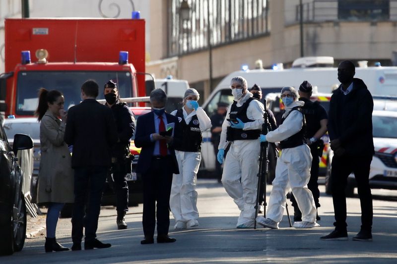 © Reuters. Police secure the area where an attacker stabbed a woman, in Rambouillet