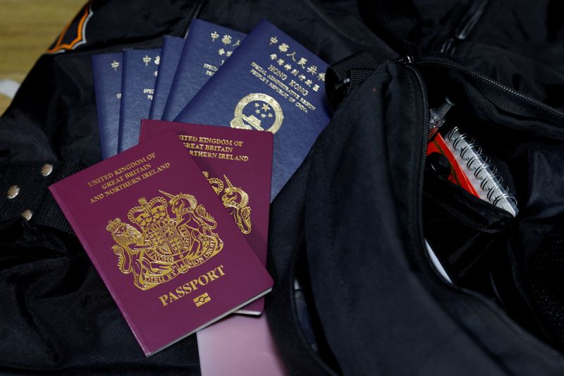&copy; Reuters. FILE PHOTO: British National Overseas and Hong Kong passports sit on luggage