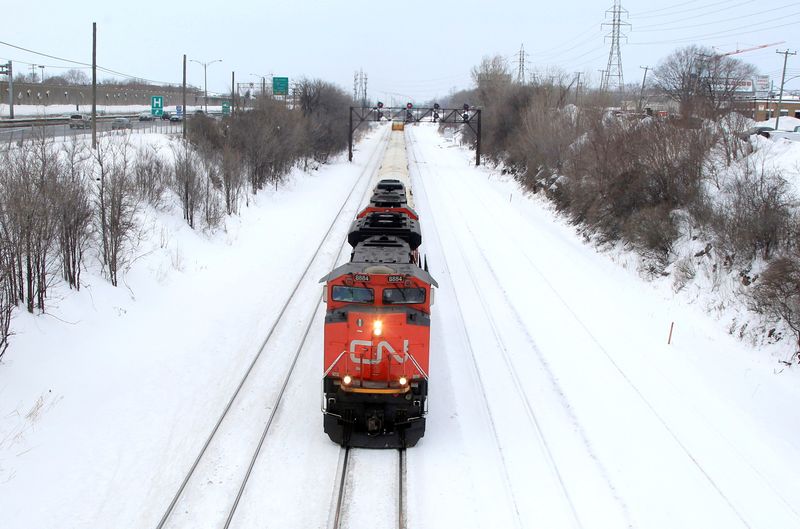 &copy; Reuters. FILE PHOTO: A Canadian National Railway train travels eastward on a track in Montreal