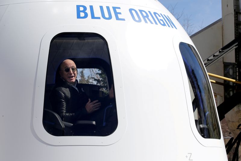 &copy; Reuters. FILE PHOTO: Amazon and Blue Origin founder Jeff Bezos addresses the media about the New Shepard rocket booster and Crew Capsule mockup at the 33rd Space Symposium in Colorado Springs