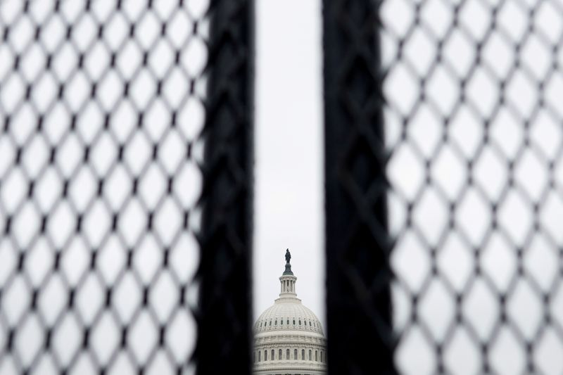 &copy; Reuters. FILE PHOTO: Security fences, erected following the January 6th attack, are seen surrounding the U.S. Capitol in Washington, U.S.