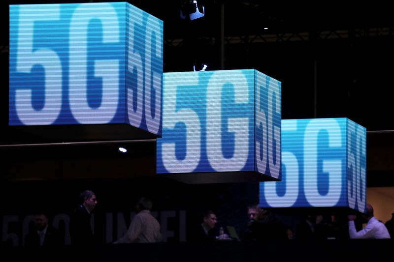 &copy; Reuters. FILE PHOTO: Hanging cubes display 5G logo at the Mobile World Congress in Barcelona