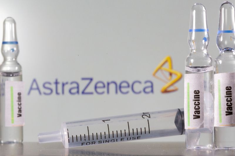 &copy; Reuters. FILE PHOTO: A test tube labelled &quot;vaccine&quot; is seen in front of an AstraZeneca logo in this illustration