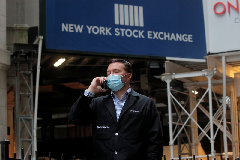 &copy; Reuters. Trader Frank Masiello talks on his phone on Wall St. outside the NYSE in New York