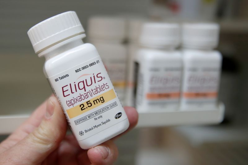 &copy; Reuters. FILE PHOTO: A pharmacist holds a bottle of the drug Eliquis, made by Pfizer Pharmaceuticals, at a pharmacy in Provo