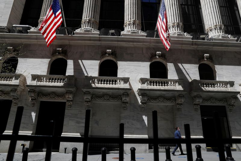 &copy; Reuters. A trader walks outside the New York Stock Exchange in  New York City