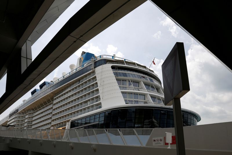 &copy; Reuters. FILE PHOTO: Royal Caribbean&apos;s Quantum of the Seas cruise ship docks at Marina Bay Cruise Center after a passenger tested positive for COVID-19 during a cruise to nowhere
