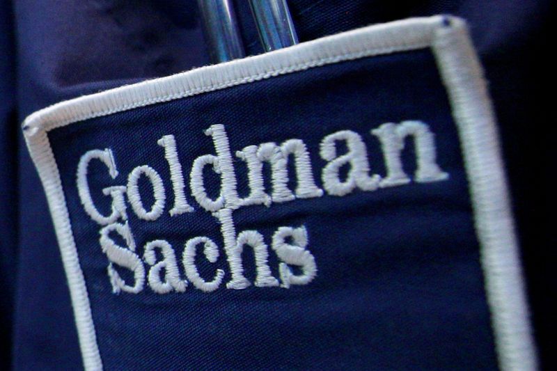 &copy; Reuters. FILE PHOTO: The logo of Dow Jones Industrial Average stock market index listed company Goldman Sachs (GS) is seen on the clothing of a trader working at the Goldman Sachs stall on the floor of the New York Stock Exchange