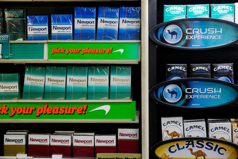 &copy; Reuters. FILE PHOTO: Newport and Camel cigarettes are stacked on a shelf inside a tobacco store in New York